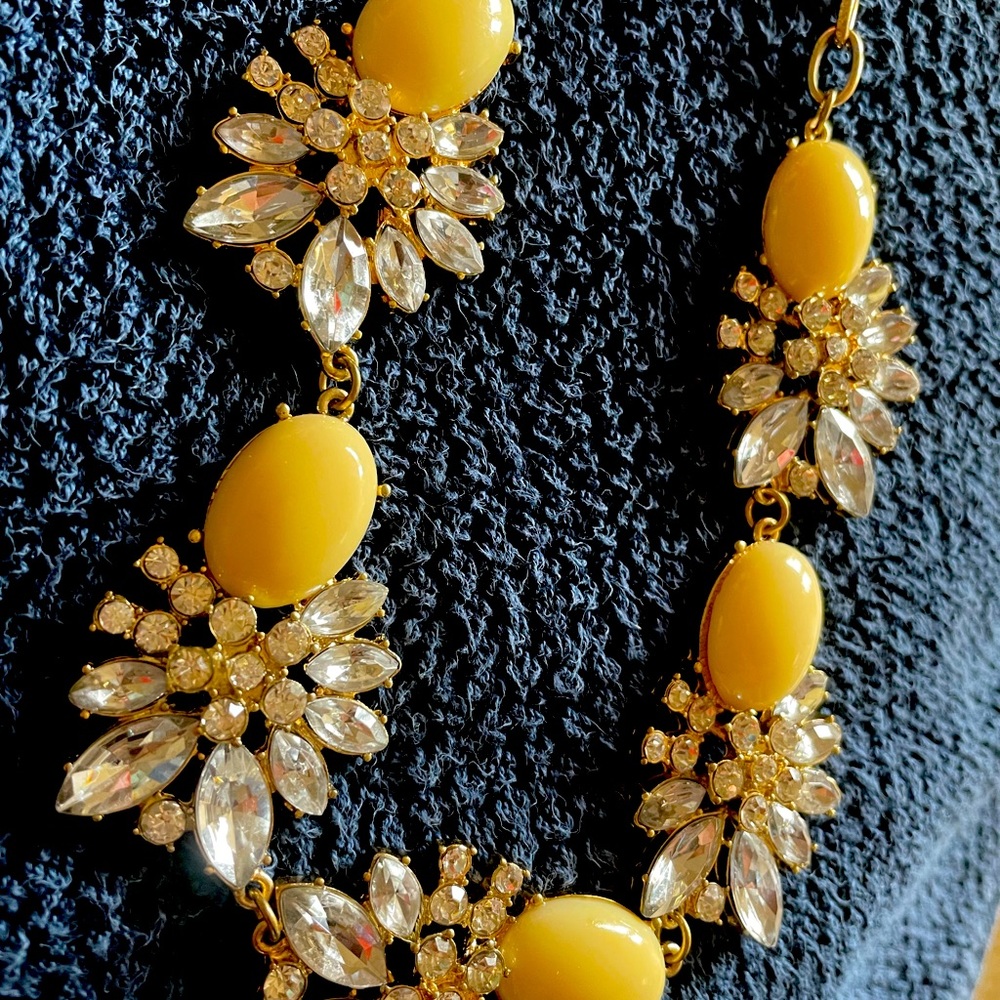 Lovely necklace with crystals. Rich creamy color. sits right below the collars.